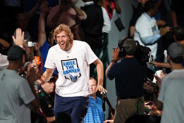 Dallas Mavericks forward Dirk Nowitzki is introduced during an event held to celebrate their NBA championship in Dallas, Texas June 16, 2011.  Dallas defeated the Miami Heat to win the 2011 NBA title. (REUTERS)