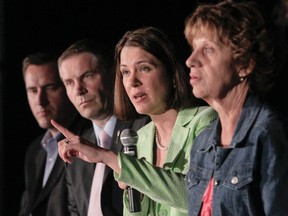 Surrounded by MLAs Rob Anderson, Paul Hinman, Heather Forsyth and Guy Boutilier, Wildrose party leader Danielle Smith speaks to a crowd in the leader and caucus accountability session during the Wildrose Party's annual general meeting at the Telus Convention Centre in downtown Calgary on Saturday, June 25, 2011. (LYLE ASPINALL/CALGARY SUN)