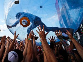 Wayne Coyne, lead singer of The Flaming Lips rolls out into the crowd in a bubble as they open the 2011 Cisco Ottawa Bluesfest Tuesday, July 5, 2011. 
 (DARREN BROWN/QMI AGENCY)