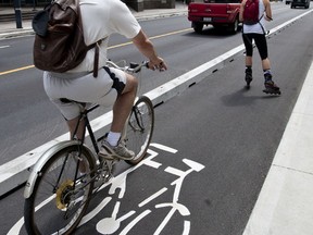 The dedicated bike lanes opened on Laurier Avenue in Ottawa on Sunday July 10,2011. (ERROL MCGIHON/THE OTTAWA SUN/QMI AGENCY)