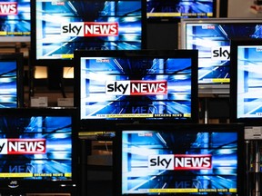 The Sky News logo is seen on television screens in an electrical store in Edinburgh in this March 3, 2011 file photo. Rupert Murdoch's powerful UK news arm reversed course and admitted its role in a long-running phone hacking scandal that had thrown into question the Prime Minister's judgment and threatened Murdoch's biggest ever deal. REUTERS/David Moir/Files