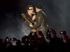 U2 are in the homestretch of their massive 360 World tour at the Rogers Centre in Toronto, on Monday, July 11/11. Lead singer Bono and guitarist the Edge - of the Irish rockers U2 - belts out Mysterious Ways as the third song of the night and gets up close and personal with the fans. (Jack Boland /  QMI Agency)