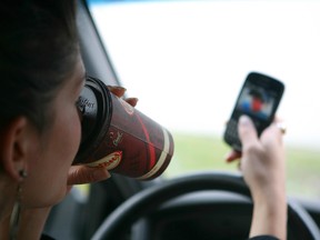 CAA Manitoba says 99.4% of more than 11,000 people surveyed have seen drivers talking on hand-held devices or texting since the legislation kicked in. (QMI Agency)