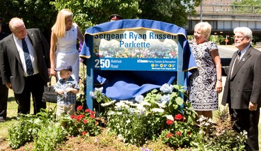 A parkette is renamed for Sgt. Ryan Russell. From left, Mayor Rob Ford, Ryan Russell’s wife Christine Russell, their son Nolan, and Russell’s parents Glenn and Linda Russell. (MARK O'NEILL/Toronto Sun)