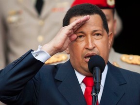 Venezuela's President Hugo Chavez salutes as he speaks to the media during a news conference at the Miraflores Palace in Caracas July 15, 2011. REUTERS/Carlos Garcia Rawlins