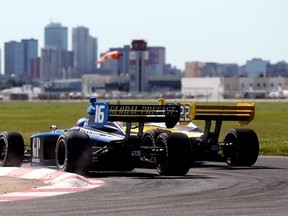 James Hinchsliffe (6) and Justin Wilson fight for position during the Firestone Indy Lights second race at the Edmonton Indy, Sunday July 24, 2011.  LAURA PEDERSEN/EDMONTON SUN QMI AGENCY