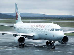 Air Canada says that the arbitrator's selection of the airline's offer to its machinist union "concludes" a new collective agreement. (QMI Agency file photo)