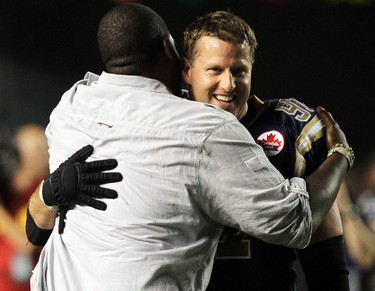 Winnipeg Blue Bombers Kelly Butler (l) hugs Doug Brown following the Bombers' 25-20 victory over the BC Lions in CFL action in Winnipeg Thursday July 28, 2011.
BRIAN DONOGH/WINNIPEG SUN/QMI AGENCY