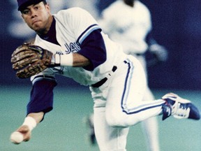 Robbie Alomar flips the ball to first, but it was his back-hand flip that defied convention, according to Mike Flanagan. (Toronto Sun files)
