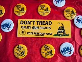 National Rifle Association (NRA) items are displayed at the NRA booth on the grounds of the Iowa straw poll in Ames, Iowa August 13, 2011.  REUTERS/Daniel Acker