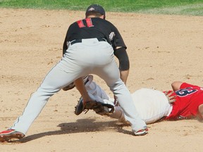 Wichita shortstop Josh Horn (left) tags out Winnipeg Goldeyes catcher Luis Alen at second base during a game earlier this season. The two teams meet for the American Association Championship, beginning Tuesday in Winnipeg. (BRIAN DONOGH/WINNIPEG SUN FILES)