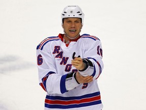 New York Rangers left wing Sean Avery adjusts his equipment after his fight with Montreal Canadiens defenseman Alexandre Picard during the first period of their NHL hockey game in Montreal, February 5, 2011.  (REUTERS/Shaun Best)