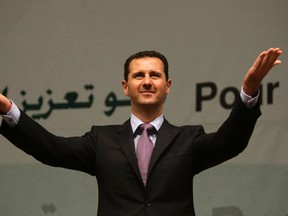 Syria’s President Bashar al-Assad gestures during the opening of the 36th Session of the Council of Foreign Ministers (CFM) of the Member States of the Organization of the Islamic Conference (OIC) in Damascus in this May 23, 2009 file photo. (REUTERS/ Khaled al-Hariri/Files)