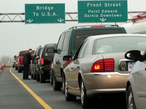 Ontario drivers wait to cross the Bluewater Bridge in Sarnia, Ont. (QMI Agency file photo)