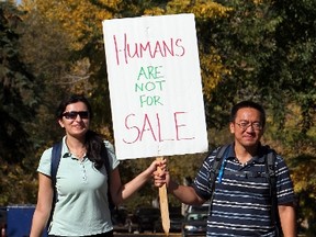 Meghana Saincher and Nick Leung make their way through Emily Murphy Park, Sunday Sept. 25, 2011, as they take part in the Freedom Relay. The walk is held in support of the victims of human trafficking and exploitation.  (DAVID BLOOM/EDMONTON SUN)