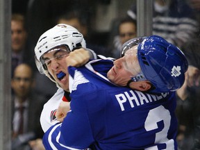 Leafs captain Dion Phaneuf and Senators Jared Cowen fight during first preseason NHL game between Ottawa Senators and Toronto Maple Leafs in Toronto,  September 19, 2011. (Alex Urosevic/Toronto Sun/QMI Agency)