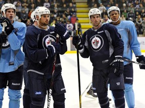 Sebastian Owuya (far right) was one of three draft picks the Winnipeg Jets decided not to sign and will go back into the 2012 NHL Entry Draft.