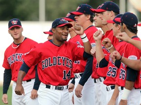 Winnipeg Goldeyes second baseman Price Kendall high-fives teammates. (BRIAN DONOGH/Winnipeg Sun files)