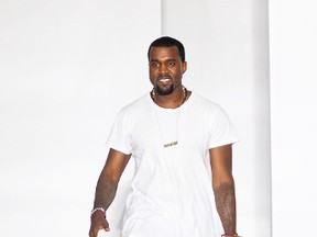Kanye West takes a walk after his Spring/Summer 2012 collection during Paris Fashion Week on Oct. 1, 2011. (WENN.com)