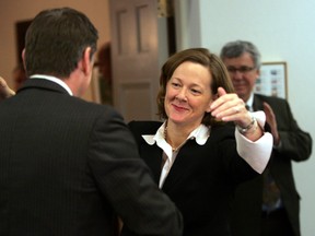 Alison Redford hugs Doug Horner as she meets with the caucus for the first time at Government House in Edmonton  on October 4th, 2011.        (PERRY MAH/EDMONTON SUN)