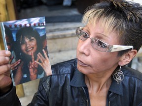 Susan Caribou looks at a photo of her neice Tanya Nepinak in Winnipeg Friday September 23, 2011. Nepinak's body is believed to be in the Brady Landfill.
(BRIAN DONOGH/WINNIPEG SUN FILES)