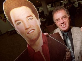 Earl McRae with his favourite entertainer Elvis after the YM/YWCA, formerly the site of the Ottawa Auditorium where the King played two shows in 1957, was named a historic site in 2001. (Errol McGihon/Ottawa Sun file photo)