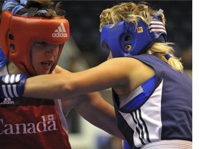 Mary Spencer of Windsor (left) competes against Irina Poteyeva of Russia in a quarterfinal bout of the 66-kg division at the 2009 world women's boxing championships in China. Spencer won the bout on her way to her second world title. (Courtesy AIBA)