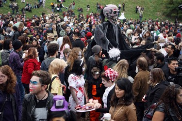 Dressed in Zombie garb, city residents attend the wedding of Thea Munster and Adam Invader. The event was held before the 9th Annual Zombie Walk in Toronto on Oct. 22, 2011. (VERONICA HENRI/Toronto Sun/QMI Agency)
