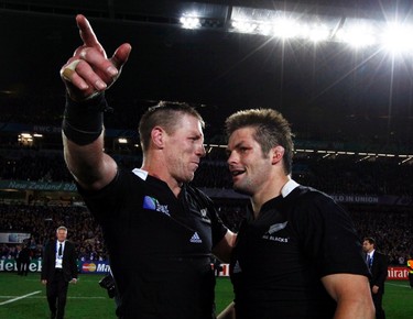 New Zealand's Brad Thorn (L) celebrates with captain Richie McCaw after beating France to win the Rugby World Cup final match at Eden Park in Auckland on Oct. 23, 2011. (REUTERS)