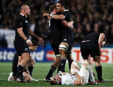 New Zealand players celebrate after beating France (in white) to win the Rugby World Cup final match at Eden Park in Auckland on Oct. 23, 2011. (REUTERS)