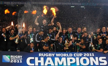 New Zealand players celebrate with the Webb Ellis Cup after beating France to win the Rugby World Cup final match at Eden Park in Auckland on Oct. 23, 2011. (REUTERS)