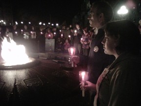 Lino Scalise and his daughter Robyn take part in the MADD Ottawa vigil on Parliament Hill last year. (KELLY ROCHE/OTTAWA SUN)