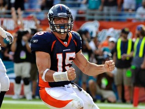 Denver Broncos' quarterback Tim Tebow celebrates after running the ball in for a two-point conversion in the fourth quarter against the Miami Dolphins on Sunday. (Reuters)
