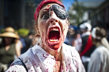 A zombie participant plays it for the camera as people gather for the annual Zombie Walk in Vancouver, BC. Aug. 20, 2011. (CARMINE MARINELLI/QMI AGENCY)