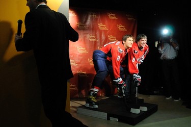 Russia's Alex Ovechkin (R), star forward for the Washington Capitals of the NHL, unveils his wax likeness in hockey gear at Madame Tussauds wax museum in Washington on Oct. 24, 2011. (REUTERS)
