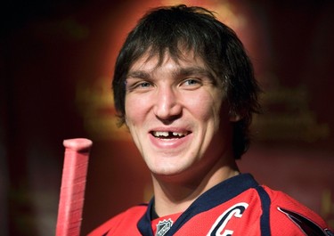 Russia's Alex Ovechkin, star forward for the Washington Capitals of the NHL, smiles at the unveiling of his wax likeness in hockey gear at Madame Tussauds wax museum in Washington on Oct. 24, 2011. (REUTERS)