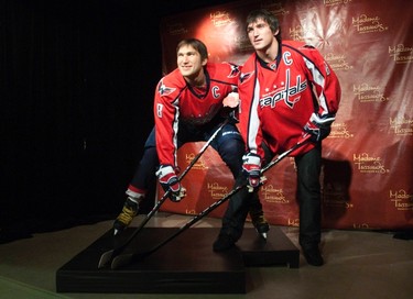 Russia's Alex Ovechkin (R), star forward for the Washington Capitals of the NHL, stands with his wax likeness in hockey gear at Madame Tussauds wax museum in Washington on Oct. 24, 2011. (REUTERS)