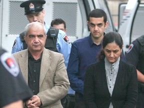 Mohammad Shafia, front left, his wife Tooba Mahommad Yahya, front right, and their son Hamed Shafia, back, arrive in Frontenac County Court in Kingston in 2012. (Postmedia Network files)