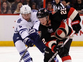 Ottawa Senators' Erik Condra (22) escapes the pursuit of Toronto Maple Leafs' Luke Schenn (2). (DARREN BROWN/QMI AGENCY)
