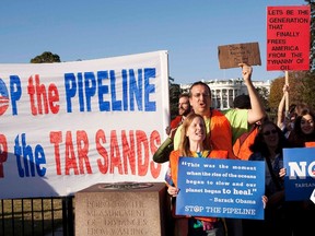 Demonstrators call for the cancellation of the Keystone XL pipeline during a rally in front of the White House in Washington November 6, 2011.  REUTERS/Joshua Roberts