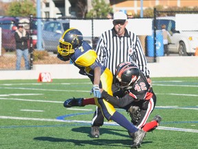 Saturday, November 5th 2011, #7 Sam Roberts from the Bell Warriors gets taken down by #42 Thabiso Bakelaar of the Myers Riders in the Sullivan Cup Mosquito division finals in the NCAFA minor football finals at Mont Bleu field. The Bell Warriors won 30-22. Matt Usherwood Ottawa Sun File photo