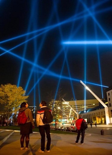Spotlights dance around the sky in downtown Montreal Wednesday November 3, 2011, part of an interactive art project by artist Rafael Lozano Hammer. Lightbeams from 20 powerful robotic searchlights are entirely controlled by a network of sensors that measure the heart rate of passers-by. (ALAIN-PIERRE HOVASSE/QMI AGENCY)