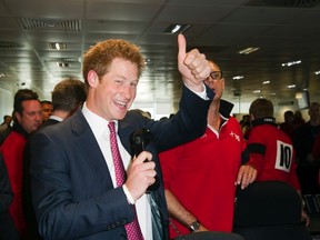Britain's Prince Harry gestures on the trading floor of  BGC Partners, in London September 12, 2011. REUTERS/Paul Grover/Pool
