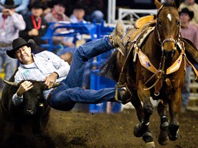 Todd Woodward of Lethbridge competes during the steer wrestling event at the Canadian Finals Rodeo at Rexall Place in Edmonton on Thursday, November 10, 2011. CODIE MCLACHLAN/EDMONTON SUN QMI AGENCY