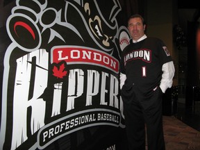 David Martin, president and general manager of the new Frontier League team the London Rippers, stands in front of a poster bearing the team’s name. (JOE BELANGER, QMI Agency)