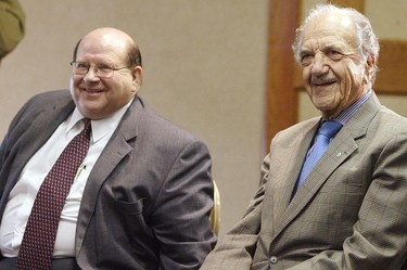 Gendis Corp. president and CEO Albert Cohen sits beside Hydro CEO Bob Brennan and smiles during a 2003 news conference announcing that the new Manitoba Hydro building will be built on Gendis property on Portage Ave. between Edmonton and Carlton.