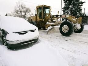 Don't get ticketed, towed, or worse — hit by a snow removal grader. (QMI Agency files)