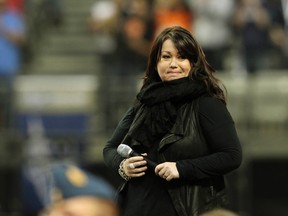 Jann Arden sings the national anthem before the start of the CFL's 99th Grey Cup game between the B.C. Lions and the Winnipeg Blue Bombers at B.C. Place in Vancouver on November 27, 2011. (Al Charest/QMI Agency)