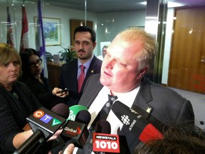 Mayor Rob Ford speaks with reporters at City Hall on Thursday. (DON PEAT/Toronto Sun)