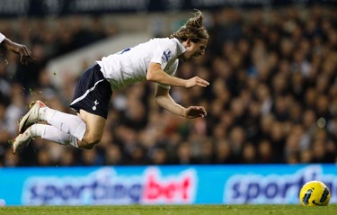 Luka Modric of Tottenham Hotspur is tripped during their English Premier League soccer match against Bolton Wanderers at White Hart Lane, north London, December 3, 2011.(REUTERS/Andrew Winning)